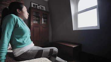 Young woman feeling stressed and isolated