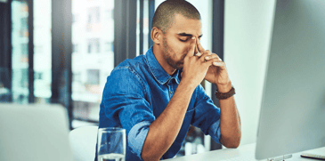 Man feeling burnout at work 