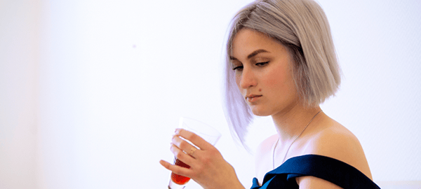 young-beautiful-girl-in-evening-dress-holding-a-glass-with-red-wine-young-beautiful-background_t20_waEK6W