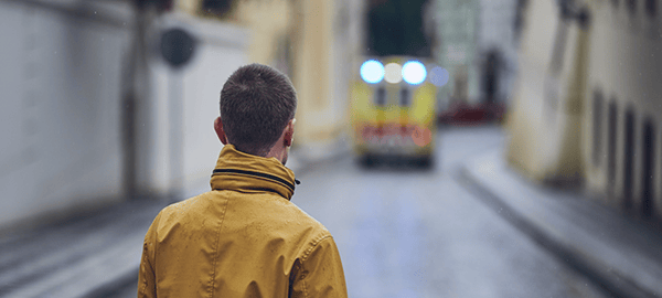 young-man-looking-at-leaving-ambulance-car-of-emergency-medical-service-concepts-health-care-rescue_t20_3wkEnN